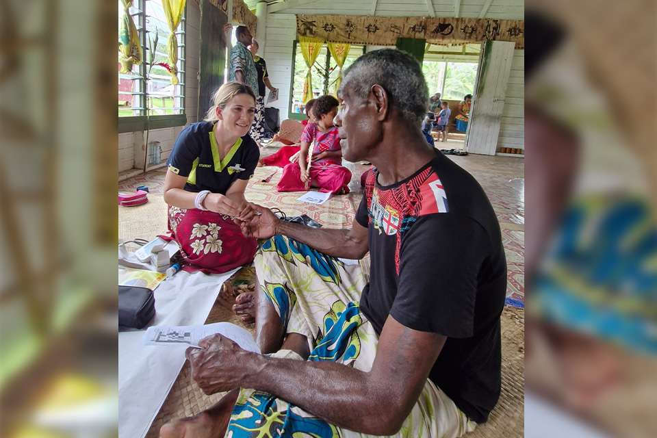 cqu student speaks to a Fijian man