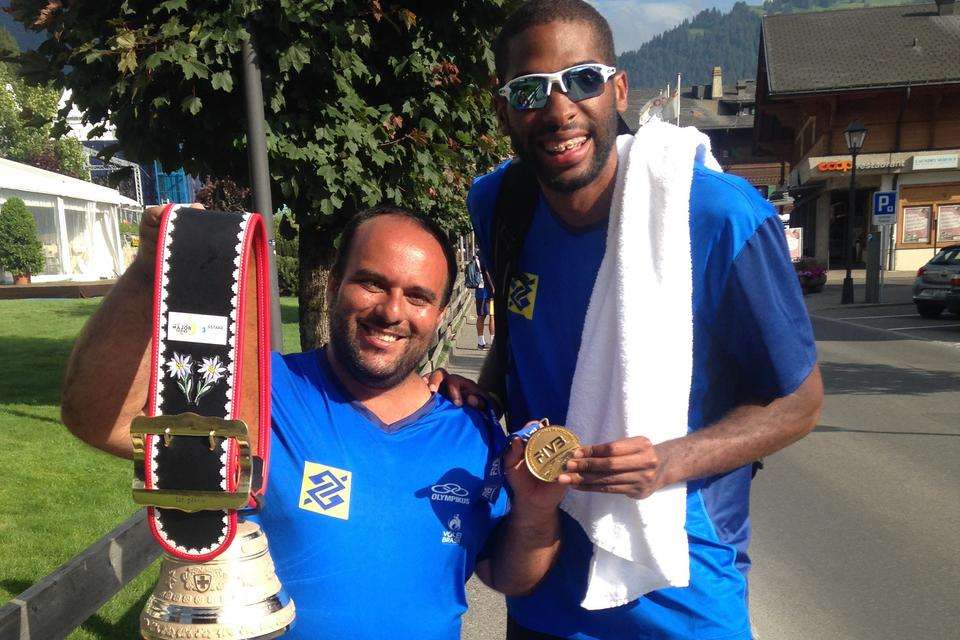 Dr Alberto Filgueiras with Evandro Goncalves holding belt with bell and medal.JPG