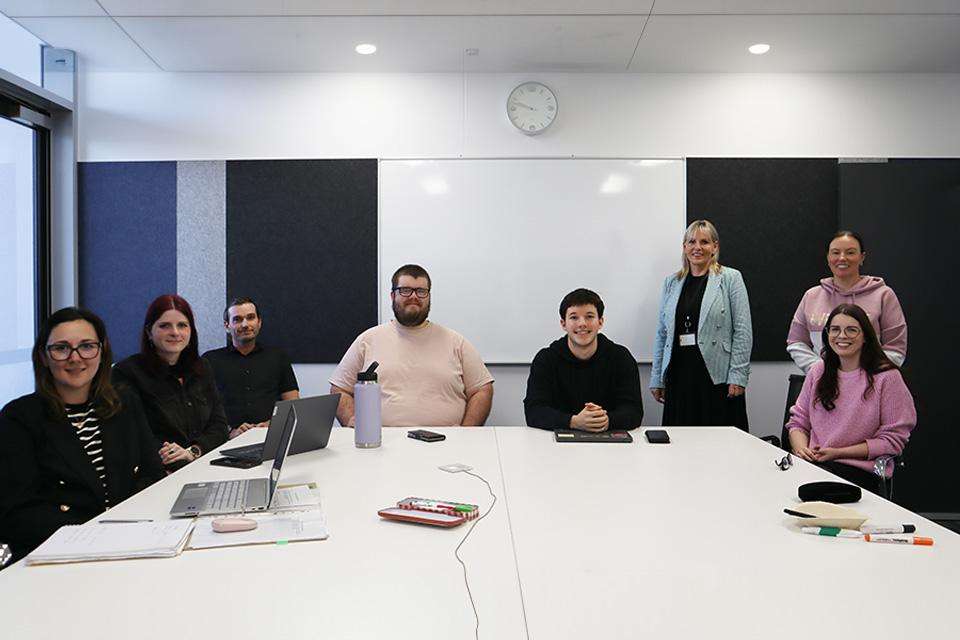 Psychology students in a tutorial class with their lecturer