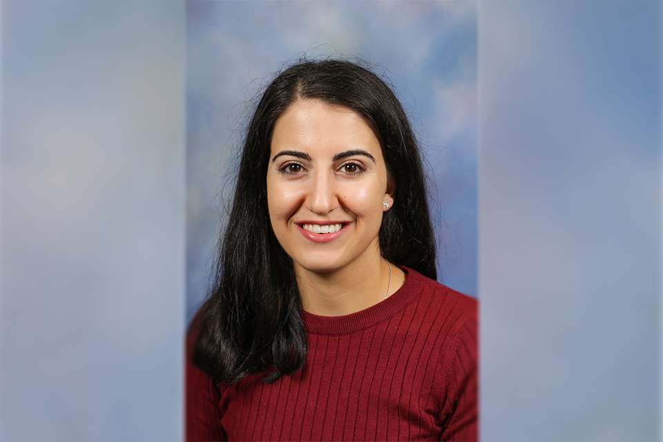 Headshot of CQU alumnus Theresa McLaurin against a dappled blue photography backdrop