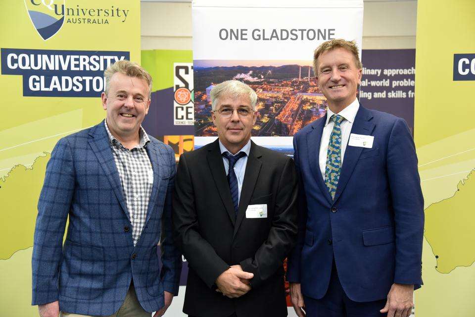 L-R - Michael O'Rourke (Stanwell) and Professor Jonathan Love and Professor Nick Klomp (CQU) stand in front of corporate banners