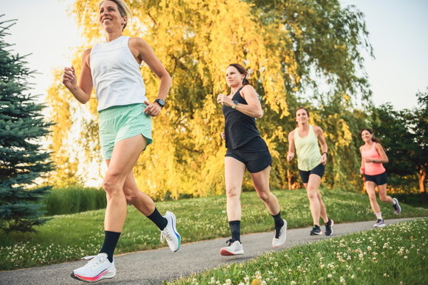 The females in sportswear jogging together bright sunny park in summer.jpeg