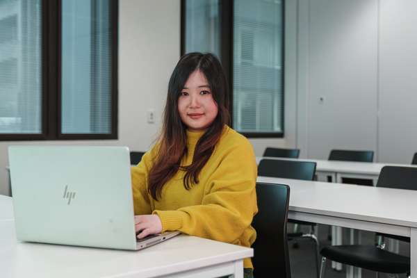International student from Vietnam My Linh Le studies at her computer.