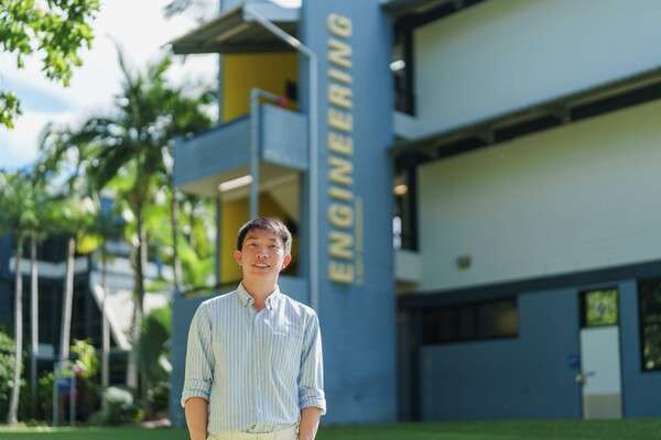 Man standing infront of Engineering building