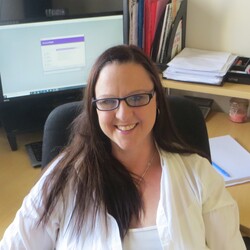 Headshot of Rachel Atkinson in her office