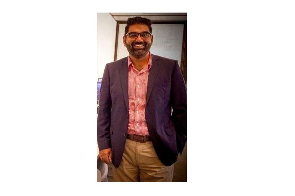 Ritesh smiling at the camera