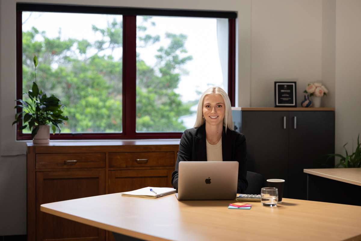 Student in a room with laptop open