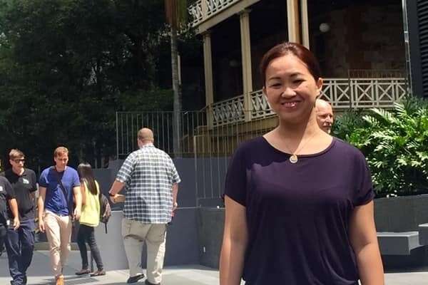 Ruby Janssen Soriano posing on the street outside the Brisbane campus