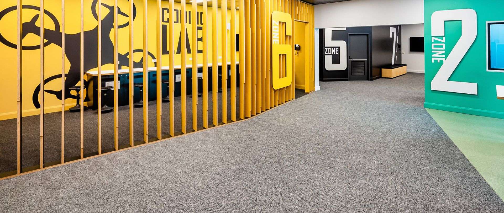Hallway intersection of inside STEM Central showing three separate study zones