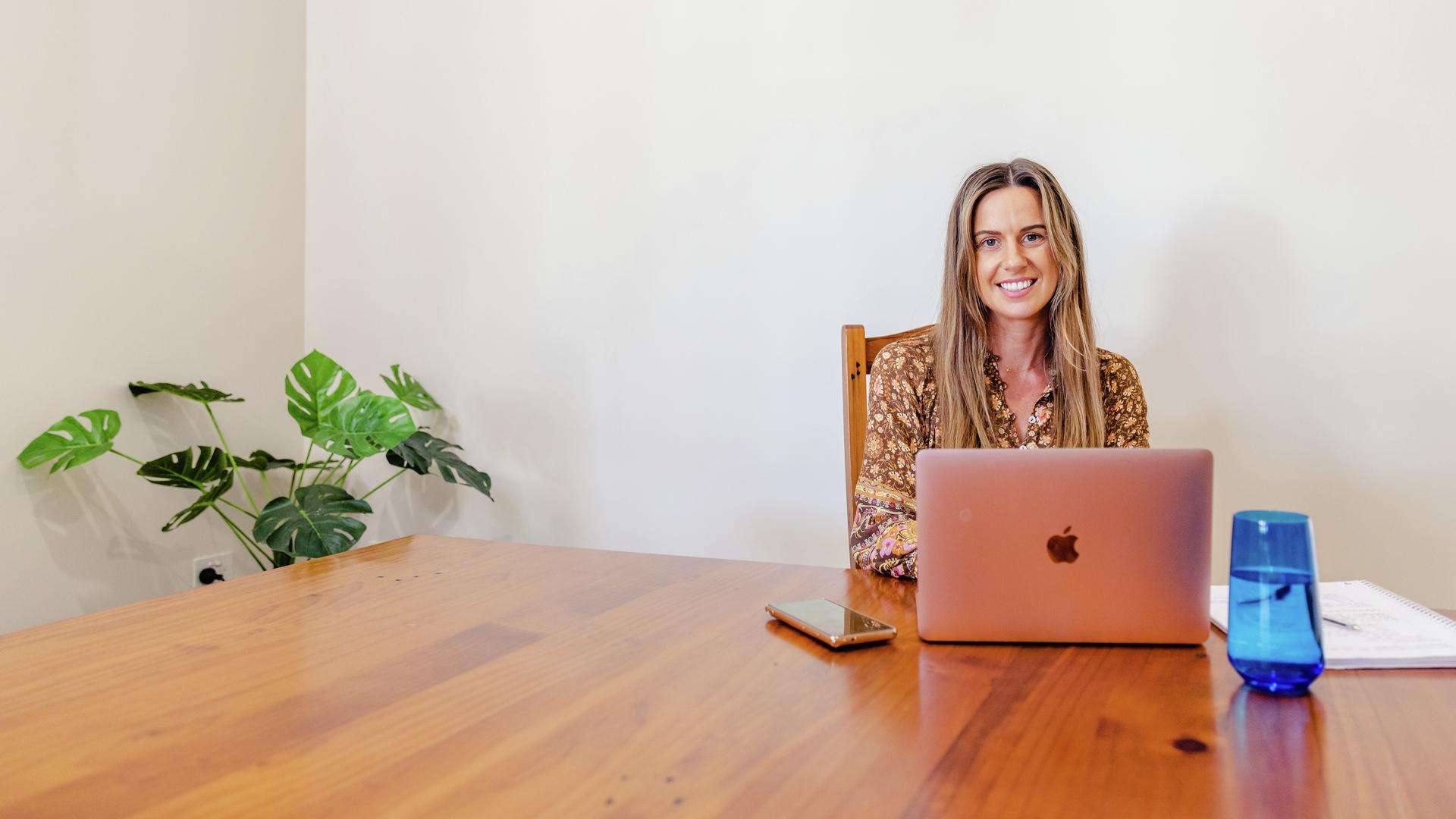 CQU student studies at a laptop at the dining table.