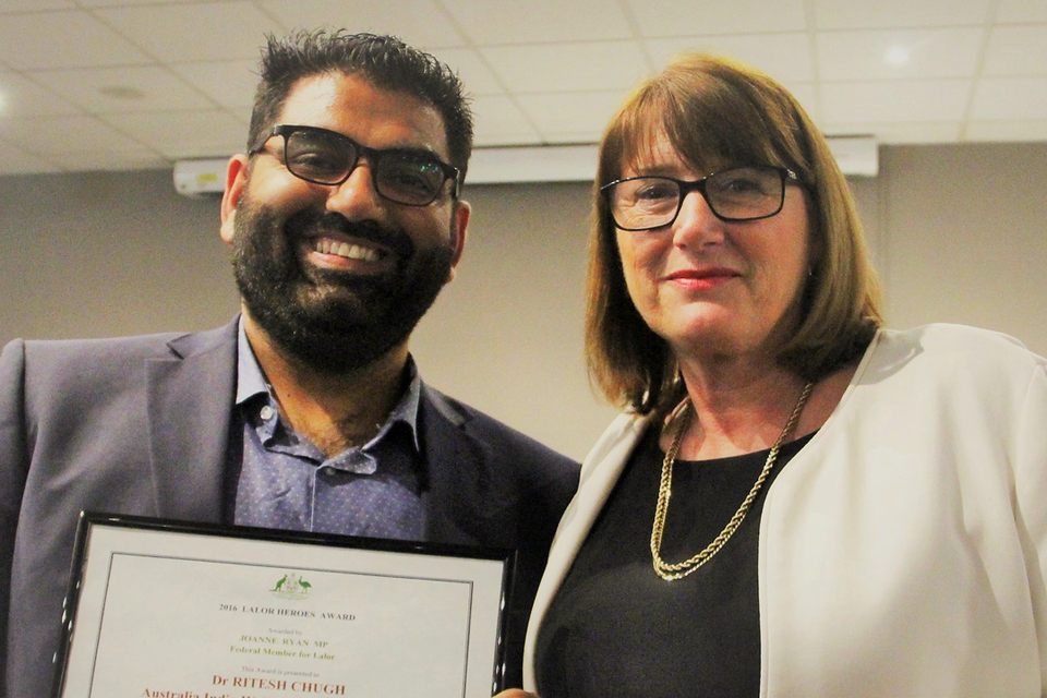 Federal Member for Lalor Joanne Ryan with Ritesh Chugh smiling with his Award