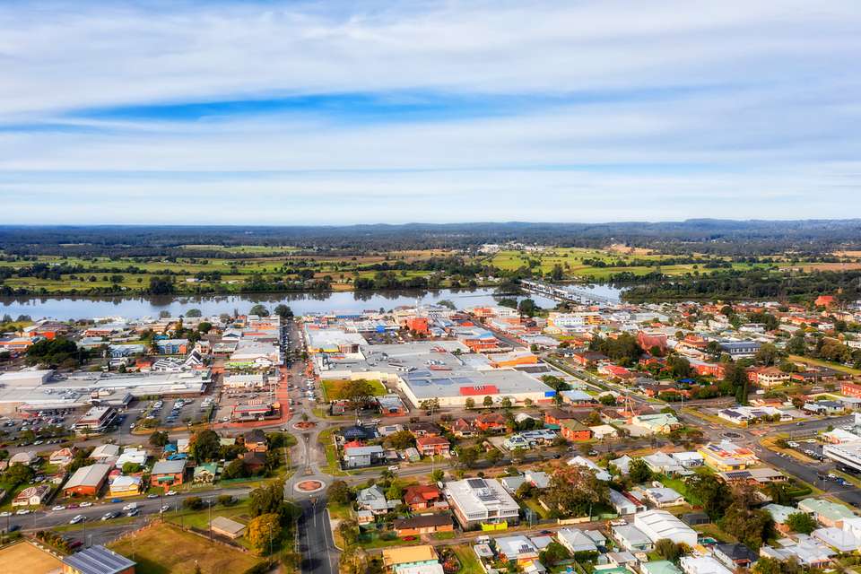 Aerial view towards Martin bridge over downtown streets of a Taree local rural town on Manning river in Australia NSW.