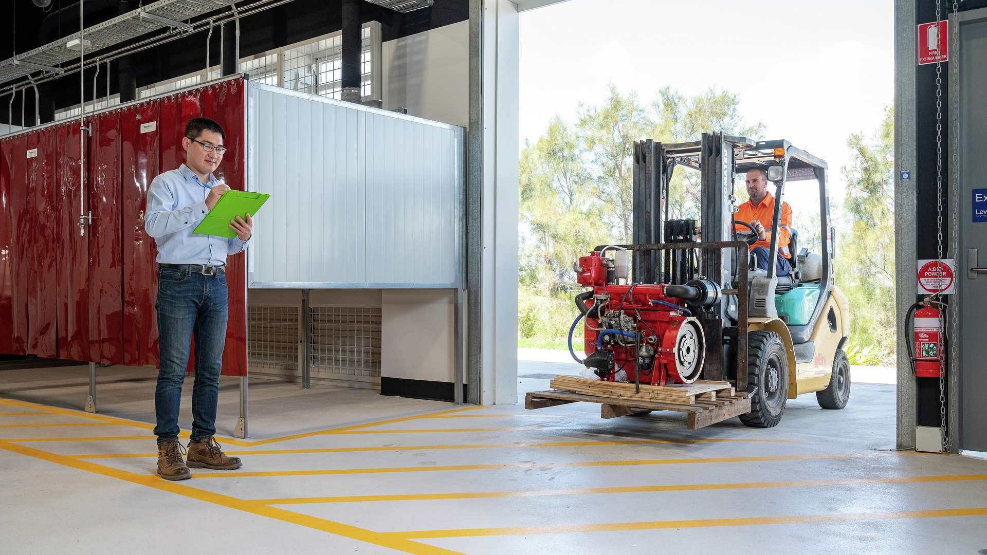 Occupational Health and Safety student assessing forklift operator in warehouse setting