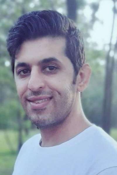 Vahid Jazi wearing a light shirt is pictured outdoors.