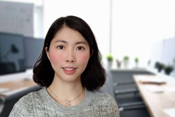 Wenwen Xu standing in a classroom setting